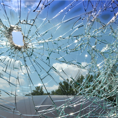 Close-up of a car's smashed windscreen